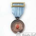 MEDALLA  MÉRITO PÒLICIAL DE LA GENERALITAT DE CATALUÑA BRONCE, DISTINTIVO AZUL.