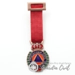 MEDALLA MINIATURA  PROTECCIÓN CIVIL  BRONCE .-DISTINTIVO ROJO.